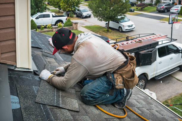 Professional Roofing technician working in Searsboro, IA